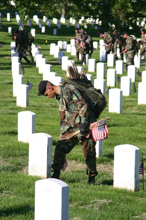 They had a process, place foot against marker, push flag in against heel. Arlington National Cemetery, 5/26/05