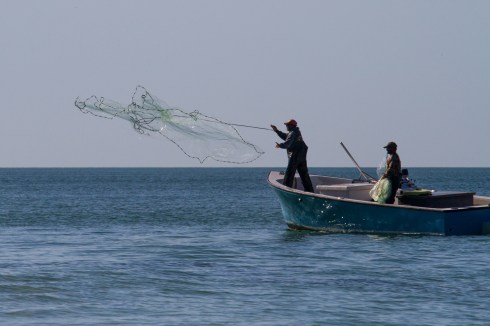 Working men on Christmas Day, North Captiva Island, FL